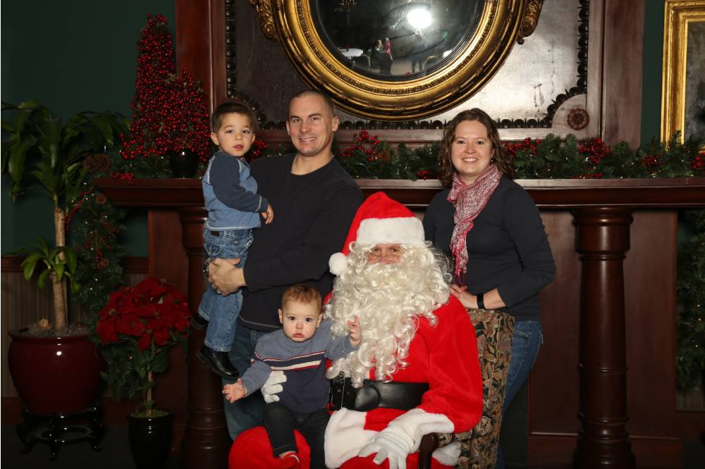 Family of four with Santa Claus